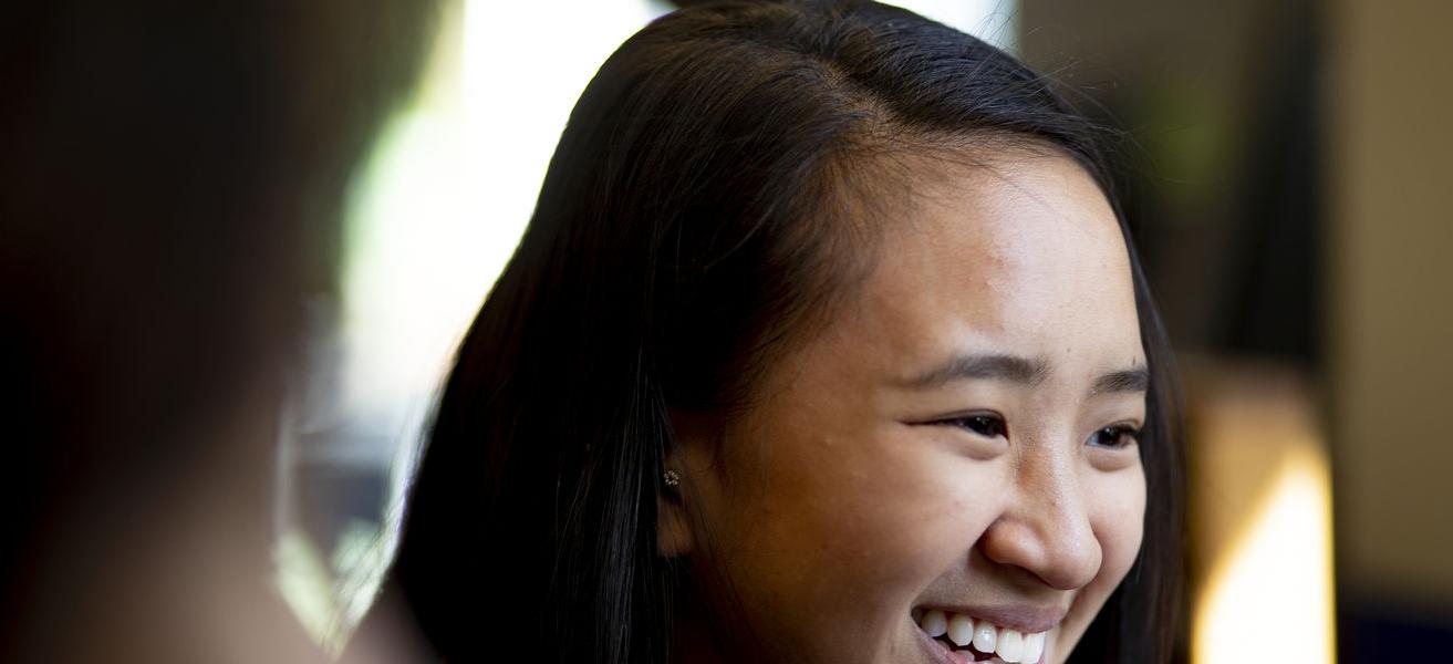 A young student smiling.